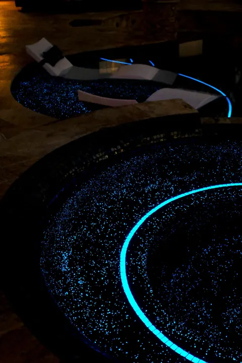 Spa ring and lounge ledge at night